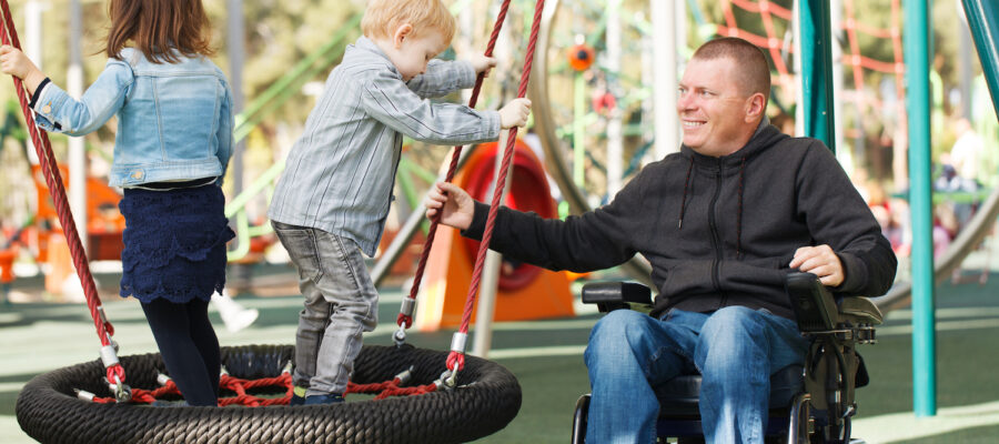 Disabled Father play with his little son and daughter